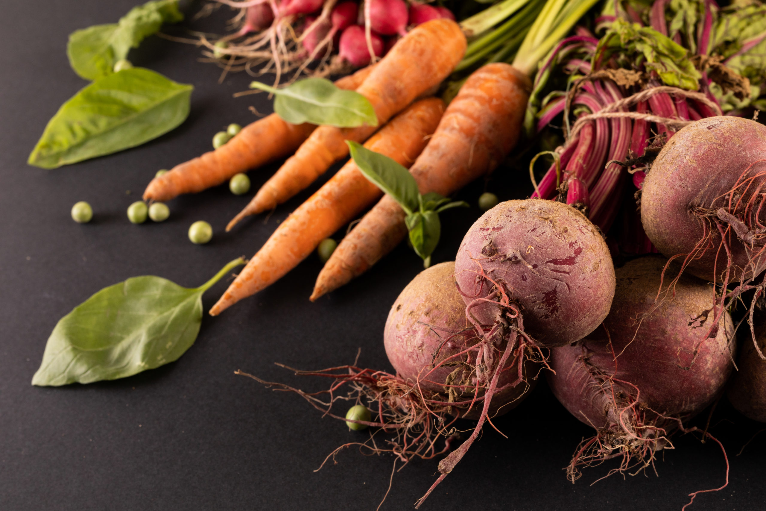 close up of carrots and beetroots with green peas 2023 11 27 05 27 44 utc scaled