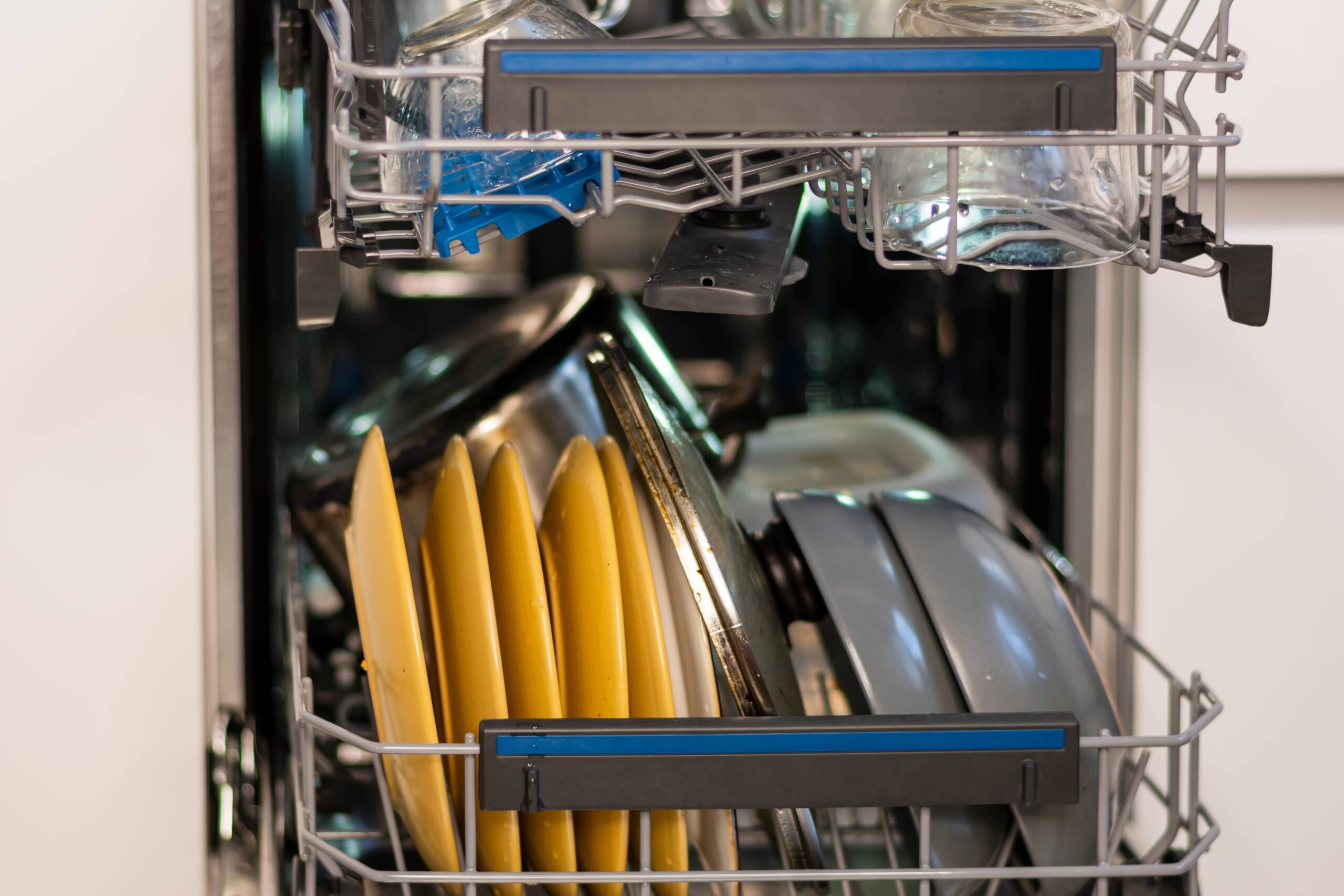 close up open dishwasher clogged with dirty dishes 2023 11 27 05 06 44 utc scaled
